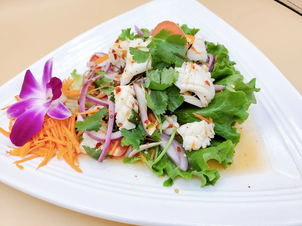 A fresh Thai salad from Thai Spoon, garnished with an orchid